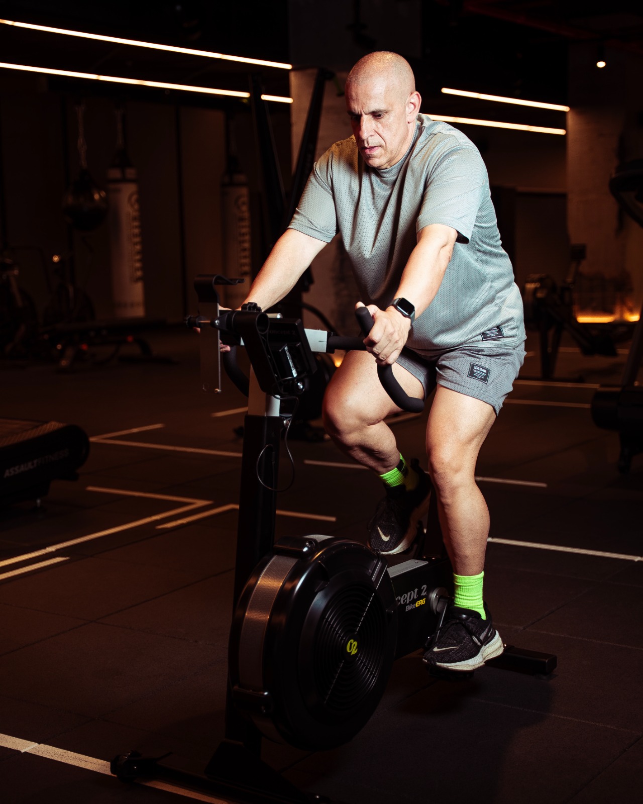Claude Louis cycling on a stationary BikeErg during the LockedIn 168 challenge