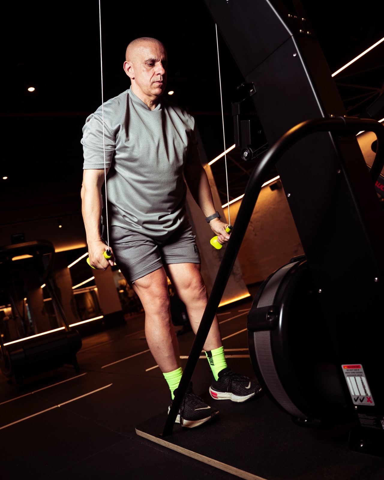 Claude Louis training on a SkiERG machine during the LockedIn 168 challenge