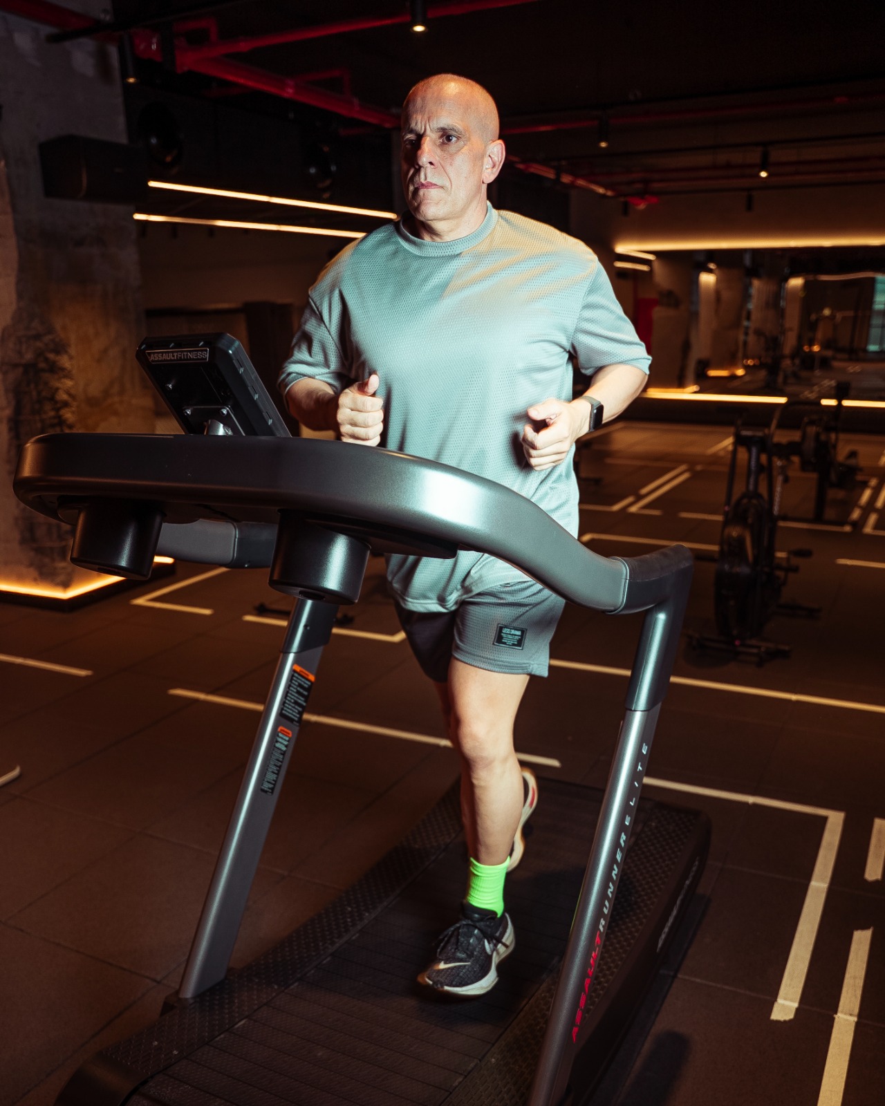 Claude Louis running on a manual treadmill during the LockedIn 168 challenge